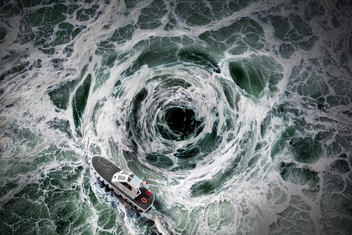 a small boat sails around an ocean whirlpool