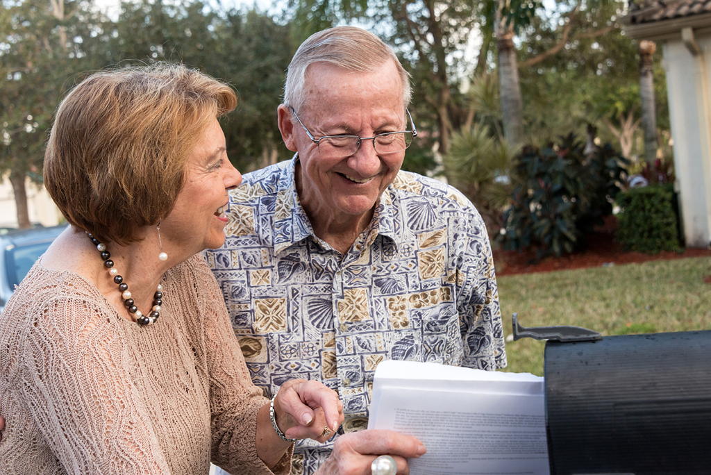 a senior couple receives mail from a direct mail campaign